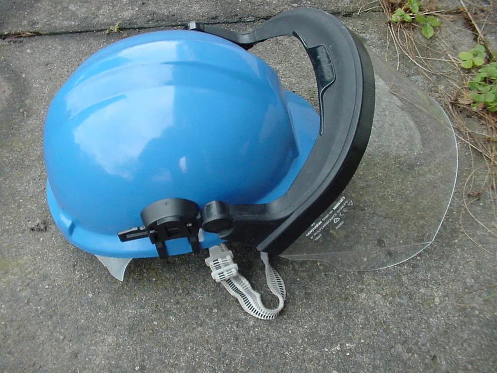 Helmet-mounted polycarbonate face shield